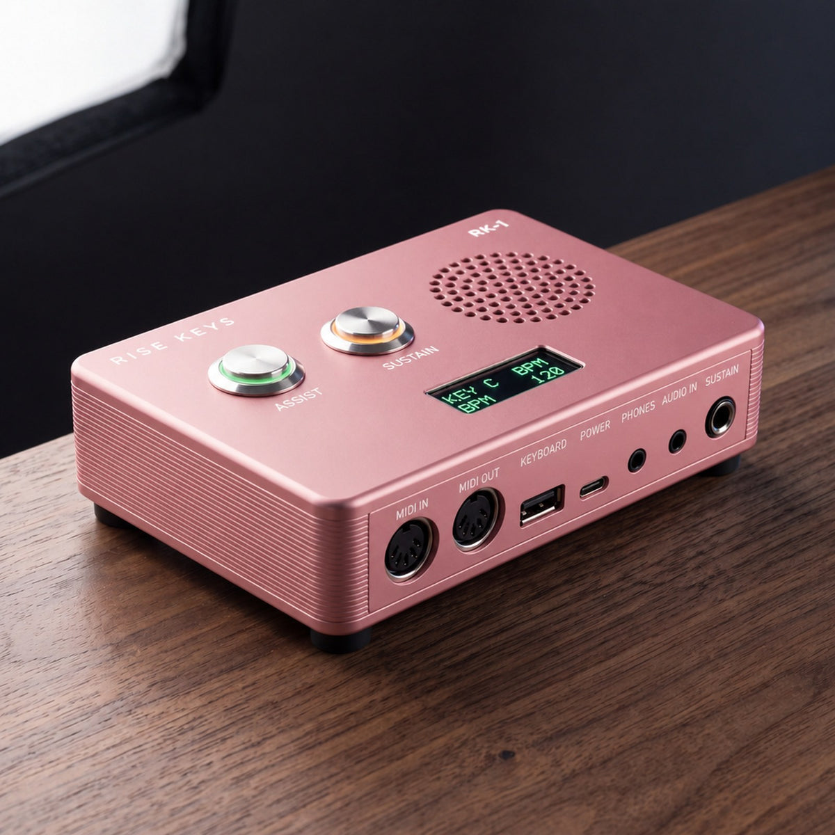 The RK-1 in Rose on a walnut desk